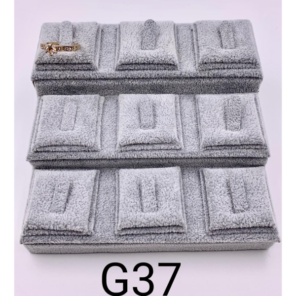 EXHIBIDOR ESCALONADO PARA 9 ANILLOS DE 15X14.5X7 CM